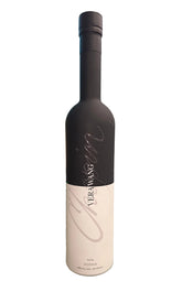 A bottle of YEN-MANG wine with a black neck and a white label featuring a large silver script logo