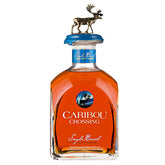 Bottle of Caribou Crossing whisky with a deer figurine on the cap against a white background