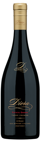A bottle of Dioha Estate Grown Three Crowns Syrah from Monterey, San Ramejo Vineyard, featuring a dark glass bottle with a gold foil capsule and elegant gold and red lettering on the label.