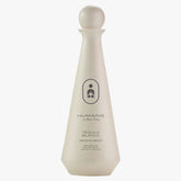 Tequila bottle labeled 'Humano' on a white background