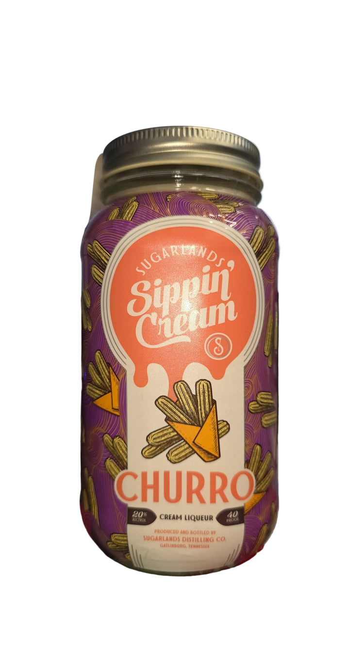 Bottle of Churro-flavored drink with a visible brand label on a blurred background