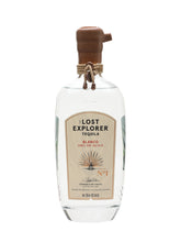 A bottle of Lost Explorer Tequila Blanco 100% de Agave, featuring a clear glass bottle with a brown wooden stopper and a beige label, set against a plain white background.