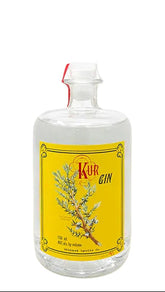 Bottle of Kuh Gin with a yellow label on a white background