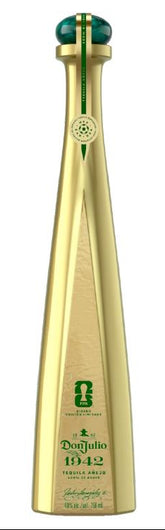 Two gold bottles and two green boxes of Doñ Julio 1942 on a white background