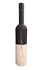 A bottle of YEN-MANG wine with a black neck and a white label featuring a large silver script logo