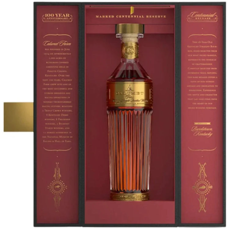 Bottle of Makers Mark Centennial Reserve whiskey in a decorative box with gold accents.