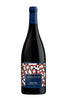 A bottle of Complicated Pinot Noir from Monterey County, featuring a dark glass body, a blue foil capsule at the top, and a colorful geometric patterned label with red, white, and blue shapes.