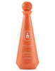 Orange tequila bottle with 'Humano' branding on a white background
