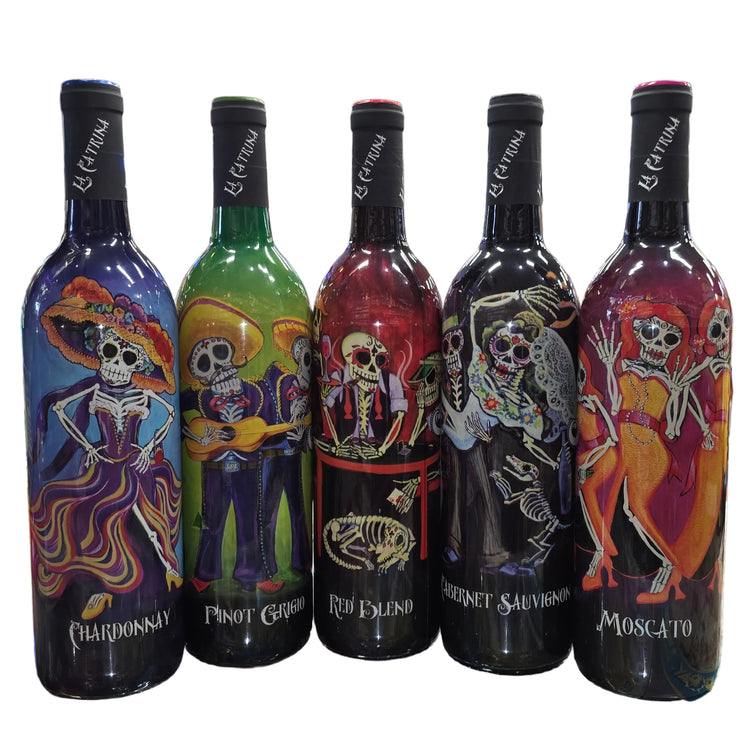Five bottles of colorful wine with skeleton designs on a store shelf.