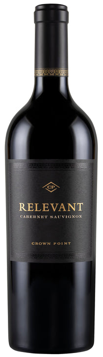 A bottle of Relevant Cabernet Sauvignon from Crown Point, featuring a dark black glass bottle with a black label and gold lettering.