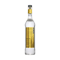 Bottle of vodka with a gold label on a white background