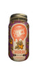 Bottle of Churro-flavored drink with a visible brand label on a blurred background