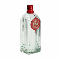 Clear glass bottle with a red cap and label on a white background