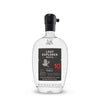 A bottle of Torola 10 Year Old Mezcal by Lost Explorer on a clean white background. The clear glass bottle features a black cap and a black label with white and red text.