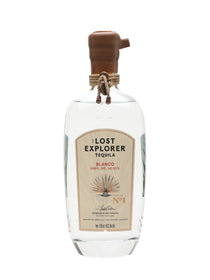 A bottle of Lost Explorer Tequila Blanco 100% de Agave, featuring a clear glass bottle with a brown wooden stopper and a beige label, set against a plain white background.
