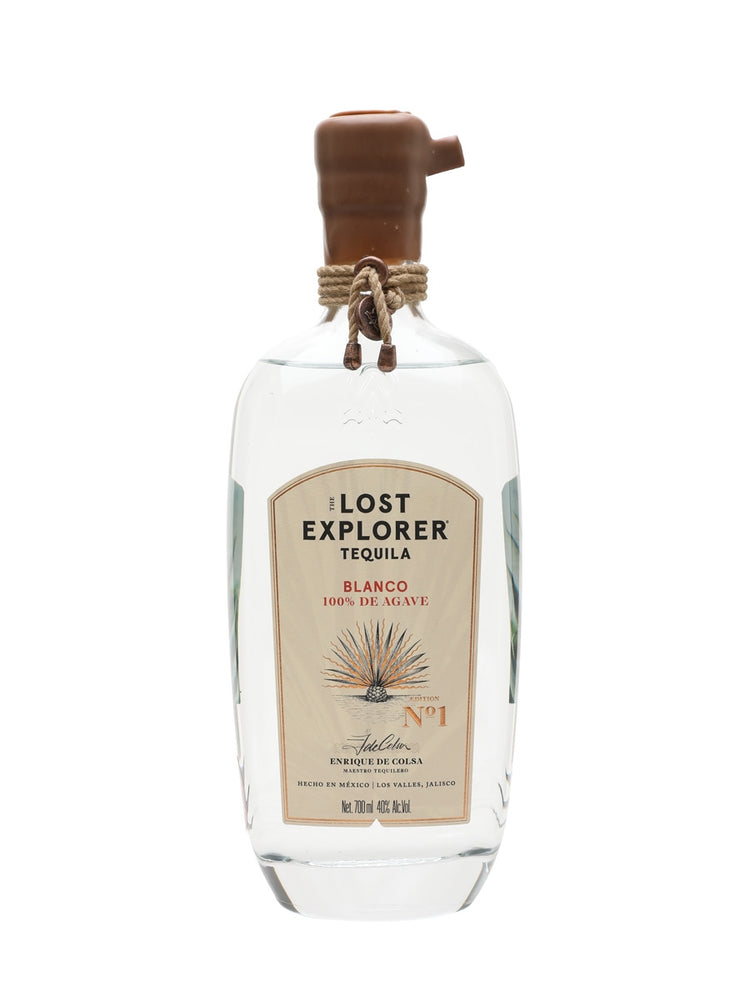 A bottle of Lost Explorer Tequila Blanco 100% de Agave, featuring a clear glass bottle with a brown wooden stopper and a beige label, set against a plain white background.