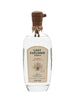 A bottle of Lost Explorer Tequila Blanco 100% de Agave, featuring a clear glass bottle with a brown wooden stopper and a beige label, set against a plain white background.