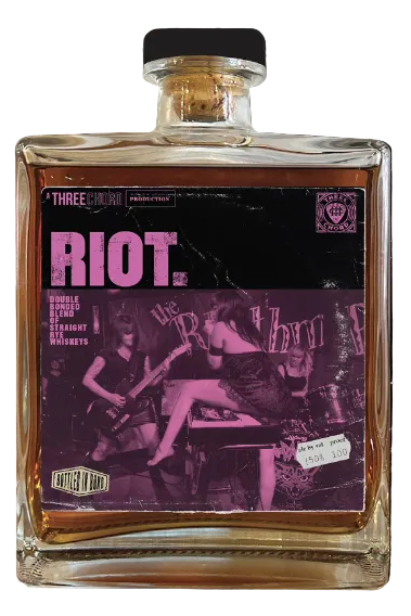 Bottle of Three Rascals whiskey with a purple label featuring musicians.