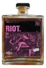 Bottle of Three Rascals whiskey with a purple label featuring musicians.