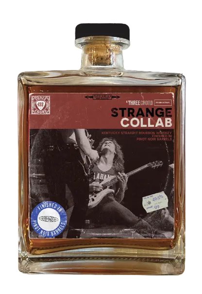 Bottle of Three Chords Strange Collab whiskey with a label featuring a graphic design.