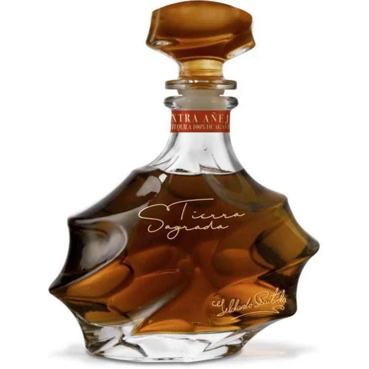 Bottle of St. Tierra Segreda tequila on a white background