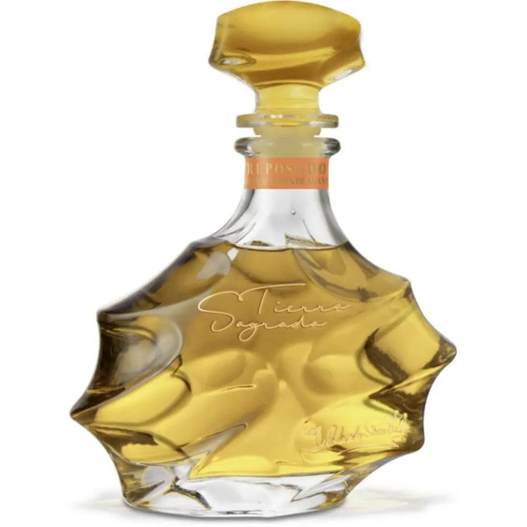 Glass bottle with a gold cap on a white background
