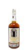 Bottle of whiskey with a label on a white background