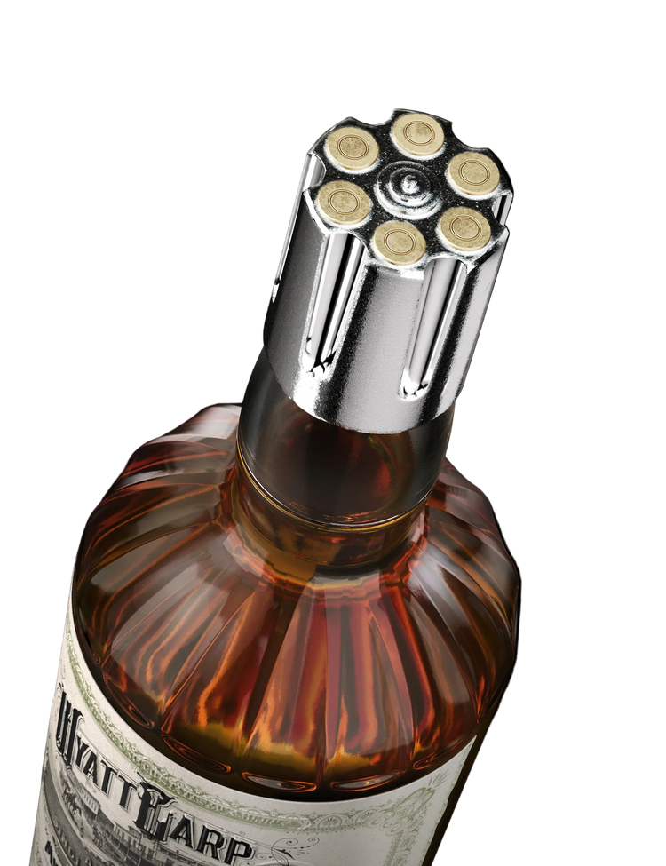Bottle cap with bullet design on a bottle labeled 'Watt & Warp' against a black background