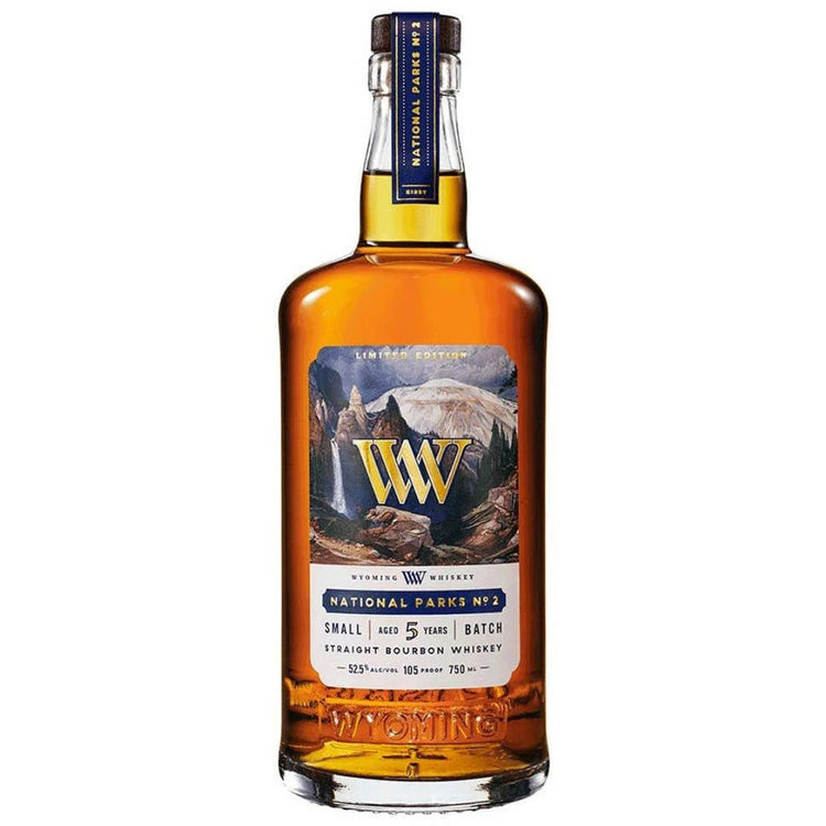 Bottle of Wilderness Whiskey with a scenic label on a white background